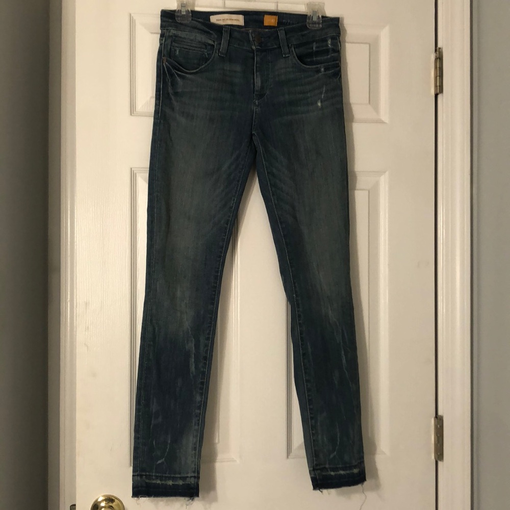 Distressed blue jeans from Anthropologie. Size 27.